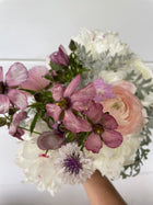 A beautiful bouquet featuring Butterfly Ranunculus alongside pink and white flowers, showcasing the stunning texture and colors that make Butterfly Ranunculus so special.