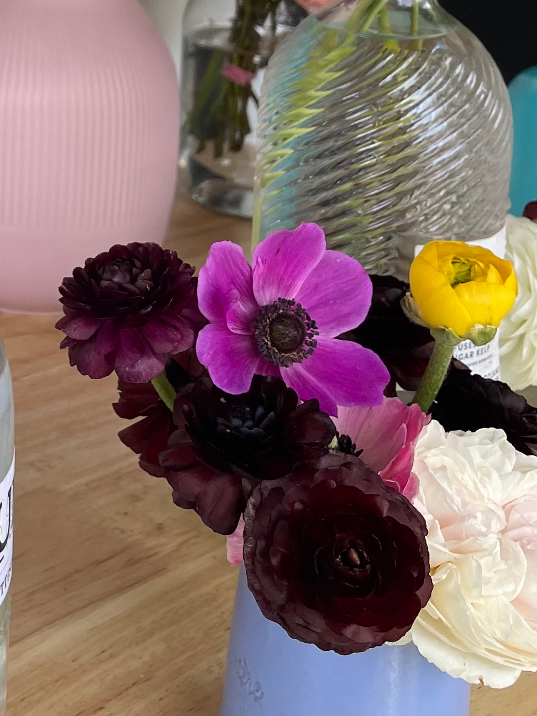 Black Amandine Ranunculus in an arrangement